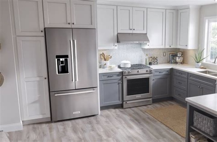 Where should the refrigerator go in a kitchen?